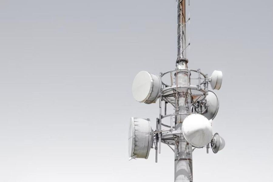 Telecom tower with microwave dishes